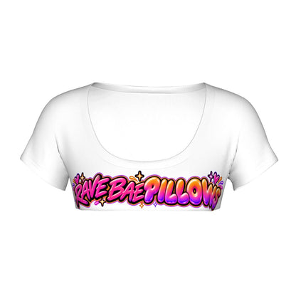The white Rave Bae Pillows micro crop top on its own, front view, with pink-to-orange graffiti lettering, hearts and sparkles